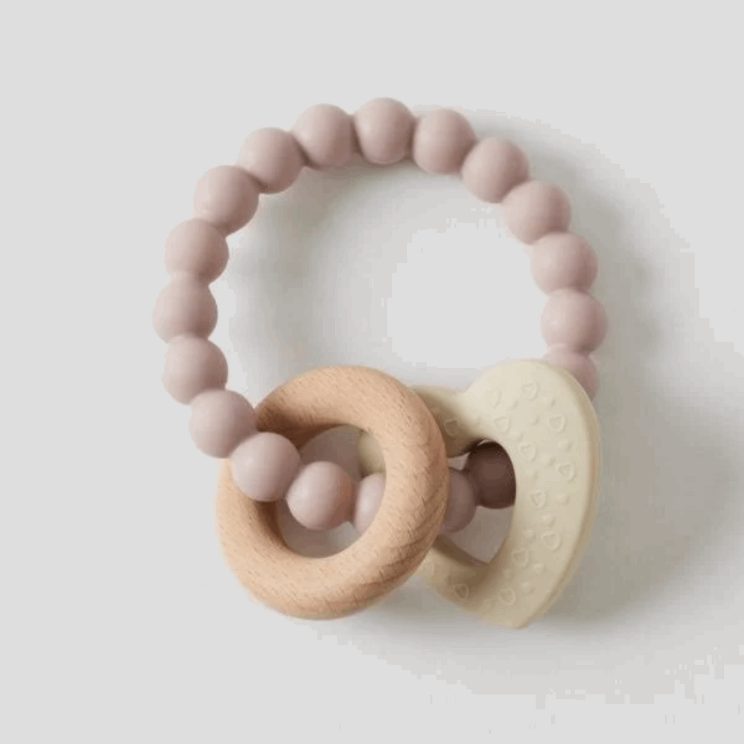 Natural and safe Mika Silicone & Wood Teether, featuring a combination of soft, BPA-free silicone beads and smooth, untreated wooden rings. Designed for soothing gums and promoting sensory development in infants.