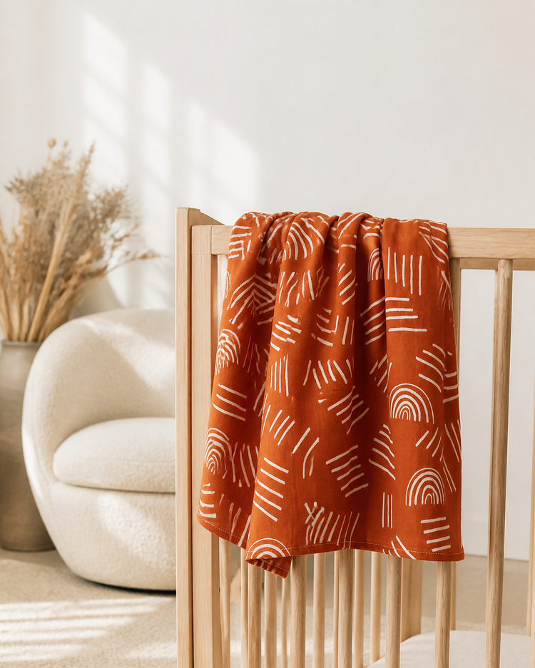 Soft muslin baby blanket in a calm nursery setting — PJ Luxe