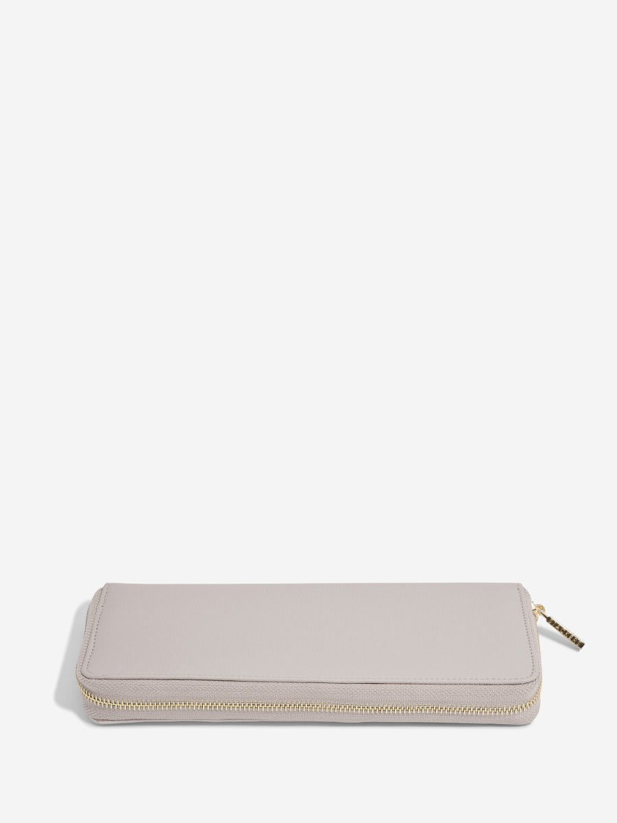 Stackers taupe medium jewellery roll zipped closed, horizontal view.