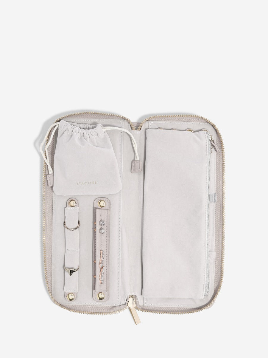 Stackers taupe medium travel jewellery roll open, showing holders, pouch and zipped pocket.