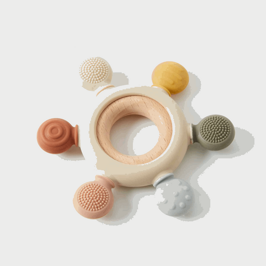 Colorful silicone sensory baby teether designed for soothing comfort, featuring multiple textures for tactile exploration and gum relief. Safe, BPA-free, and easy for little hands to grasp.