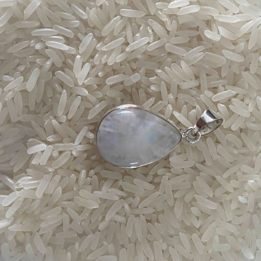 Elegant teardrop pendant crafted from sterling silver, featuring a luminous moonstone at its heart, capturing the essence of sophistication with a touch of celestial beauty.