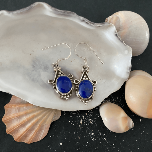 Sterling silver earrings adorned with serene blue jasper stones, showcasing an elegant design that exudes tranquility and refined grace.