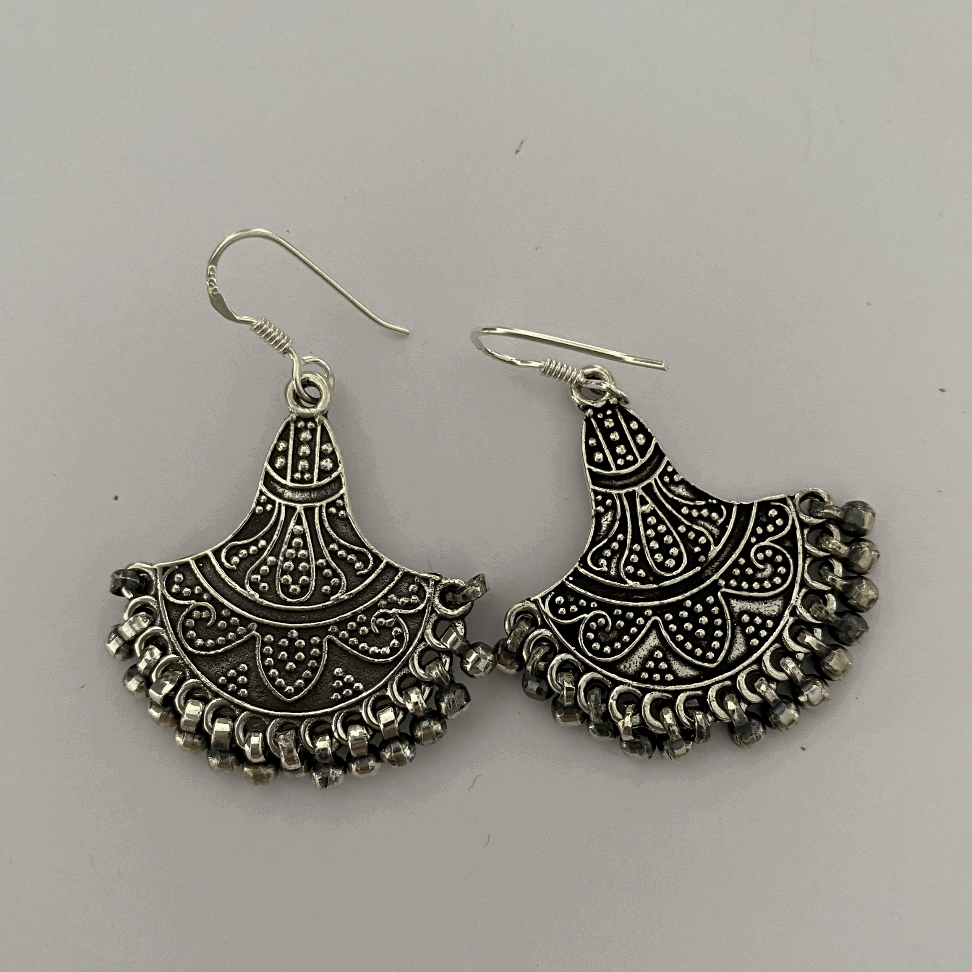 Exquisite Bohemian Antique Silver Chandelier Earrings featuring ornate filigree designs and dangling beads, encapsulating a vintage boho elegance with intricate detailing for a statement look.