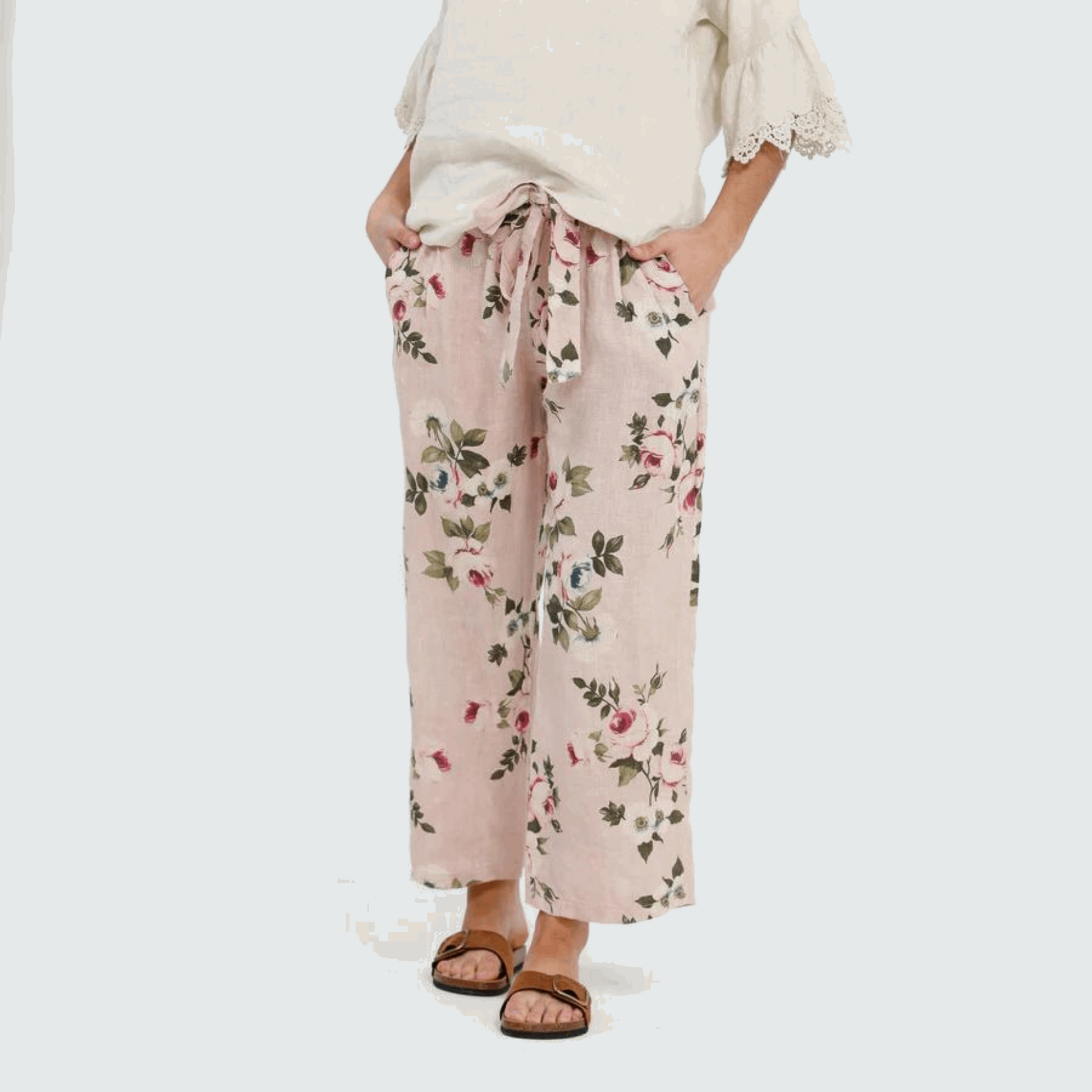 Eva Floral Linen Pants by Miss Rose Sister Violet with a bright floral pattern, drawstring waist, and a relaxed fit, embodying casual elegance.