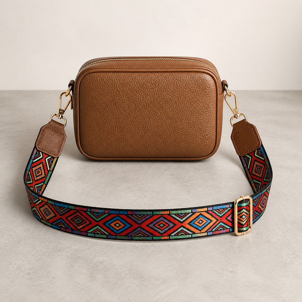 Carnival Diamond bag strap attached to a cognac crossbody bag; bag not included
