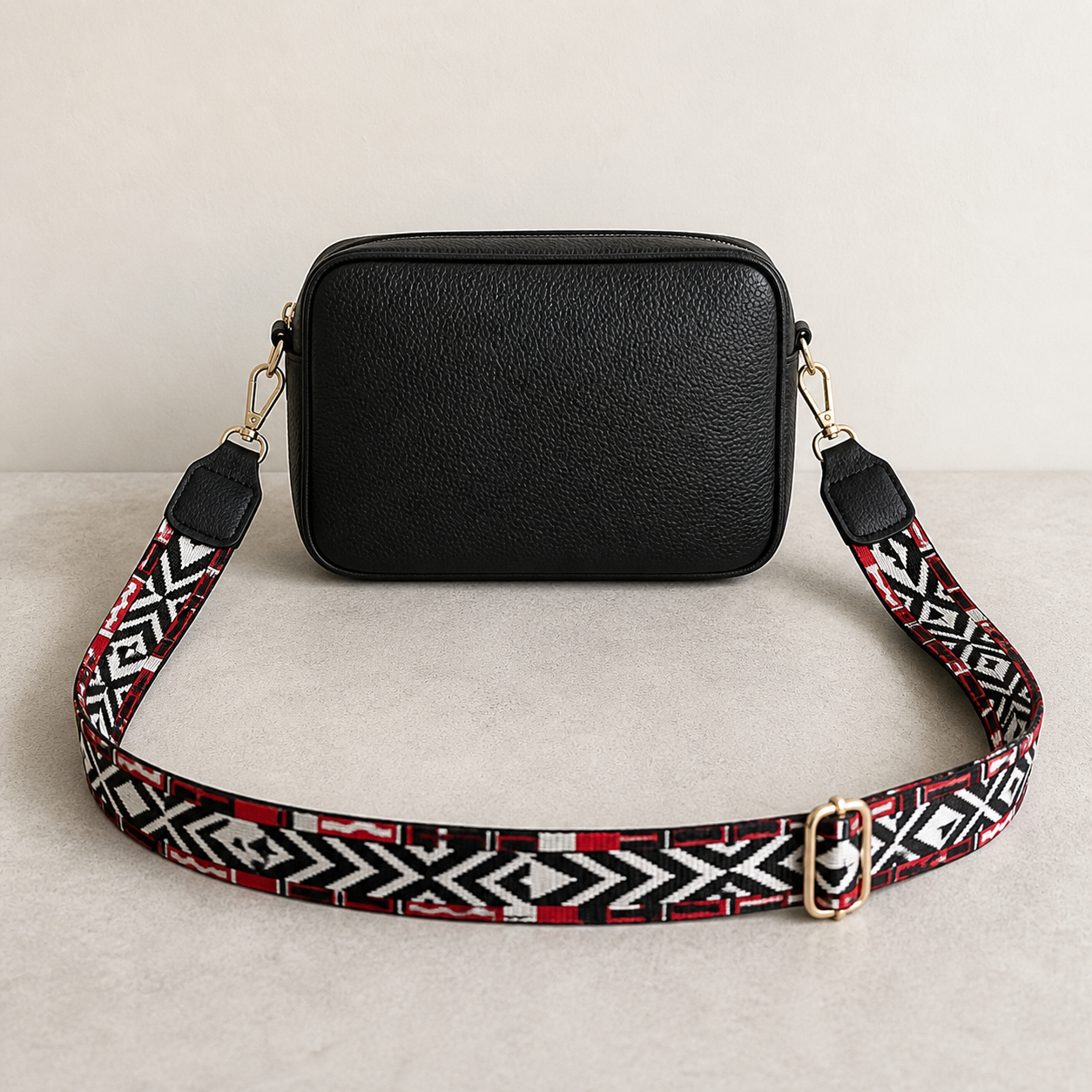 Crimson Tribal black trim bag strap attached to a black crossbody bag; bag not included