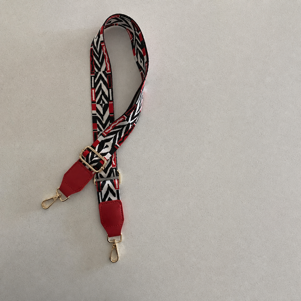 Crimson Tribal red trim interchangeable bag strap, exact product photo without lettering