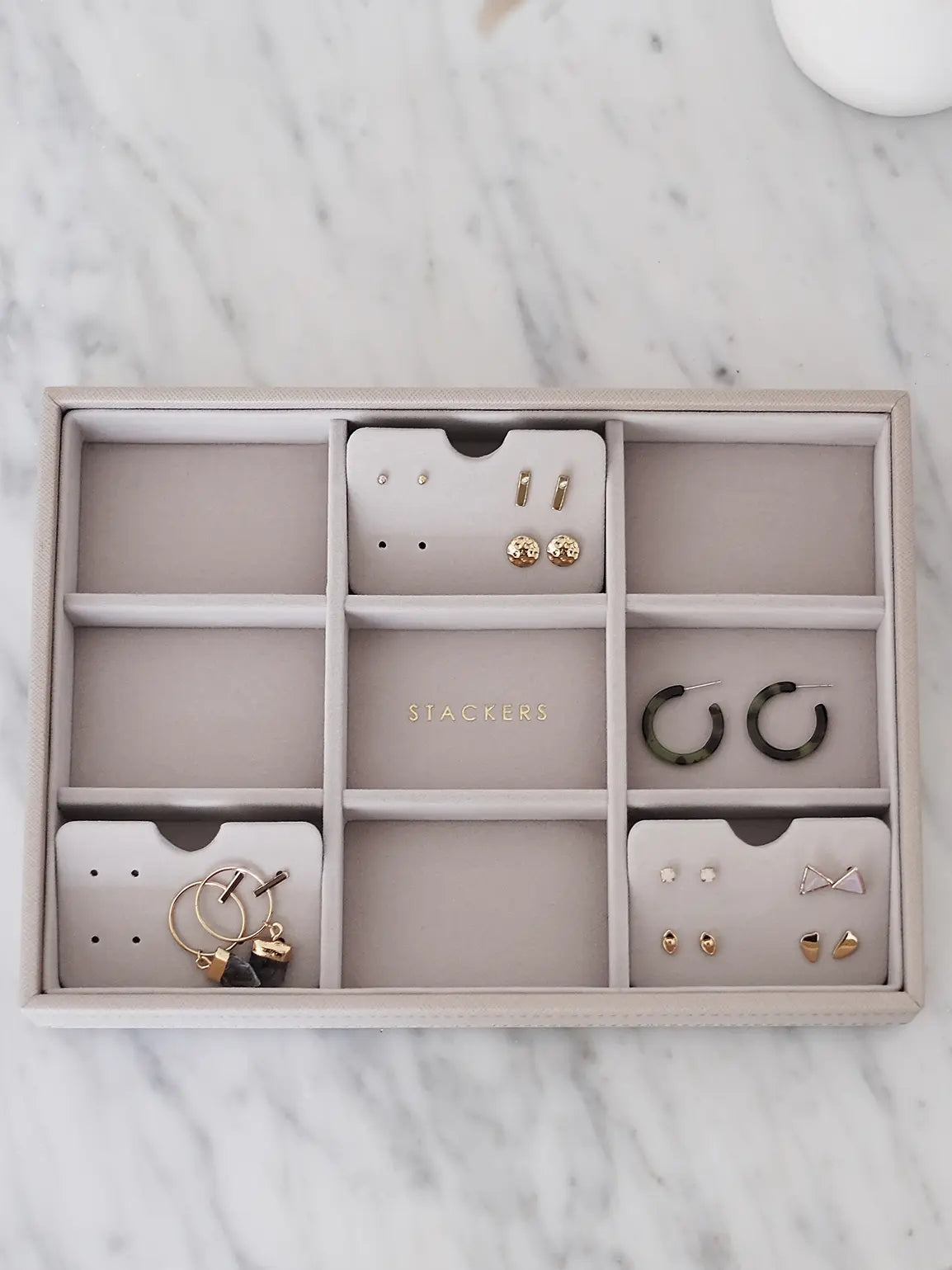 Stackers earring holders arranged inside a jewellery box layer. Earrings and box sold separately.