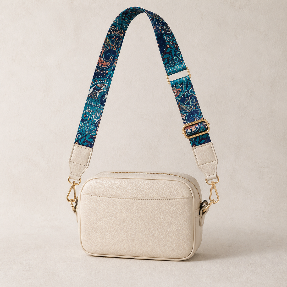 Midnight Paisley interchangeable strap styled on a cream crossbody bag; bag not included