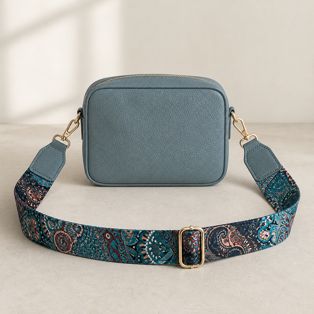 Peacock Paisley bag strap attached to a slate blue crossbody bag; bag not included