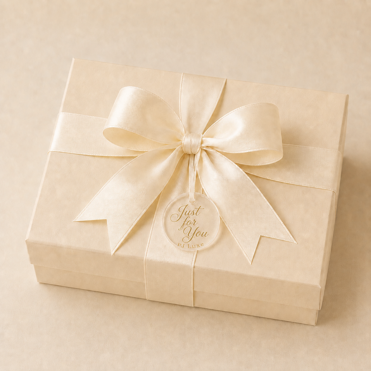 Ivory PJ Luxe gift box with cream ribbon and clear acrylic tag reading Just for You, PJ Luxe
