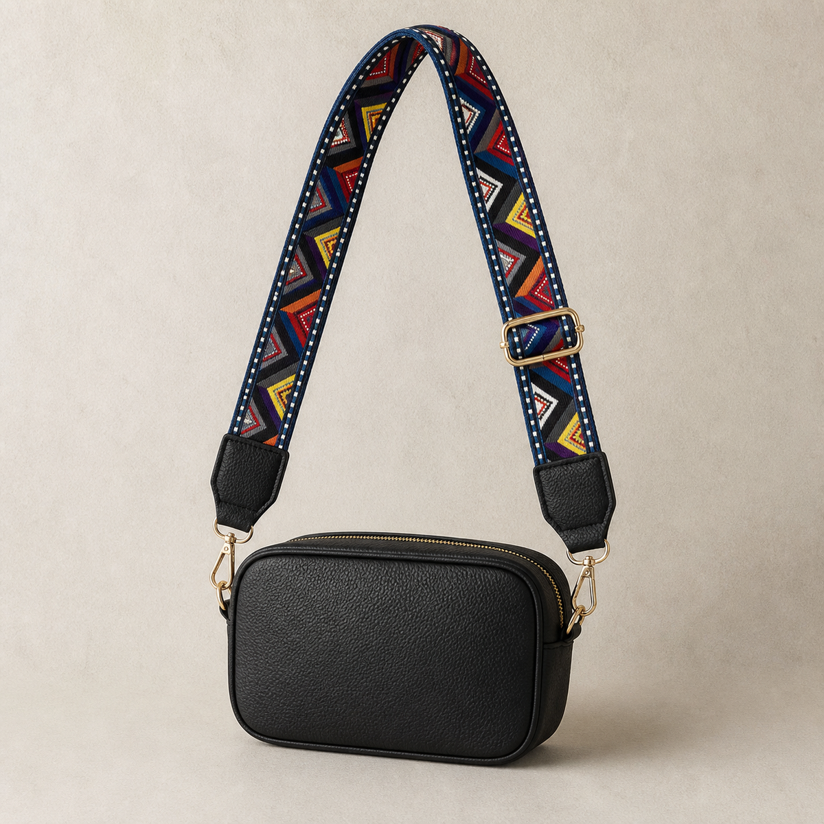 Prism Chevron interchangeable strap styled on a black crossbody bag; bag not included