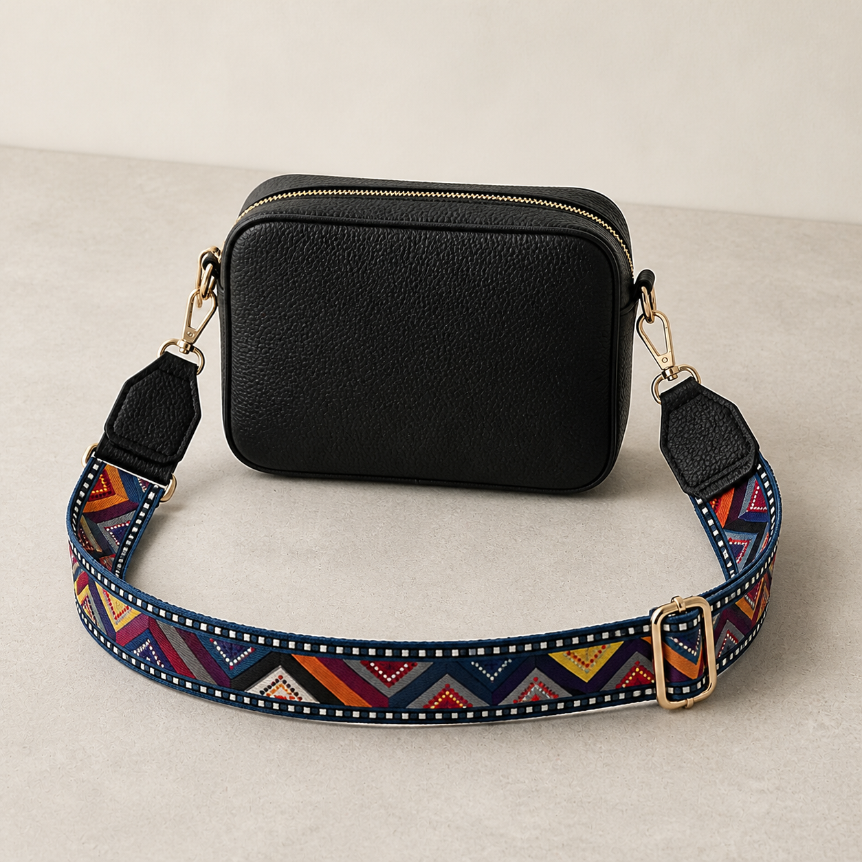 Prism Chevron bag strap attached to a black crossbody bag; bag not included