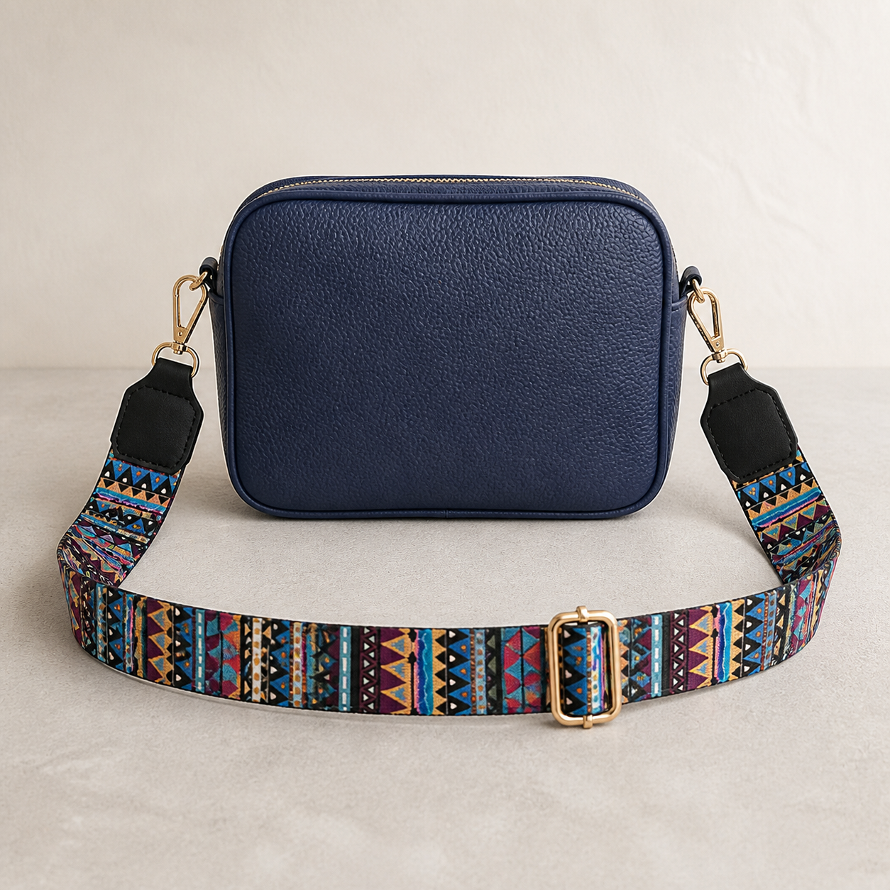Sunset Aztec bag strap attached to a navy crossbody bag; bag not included