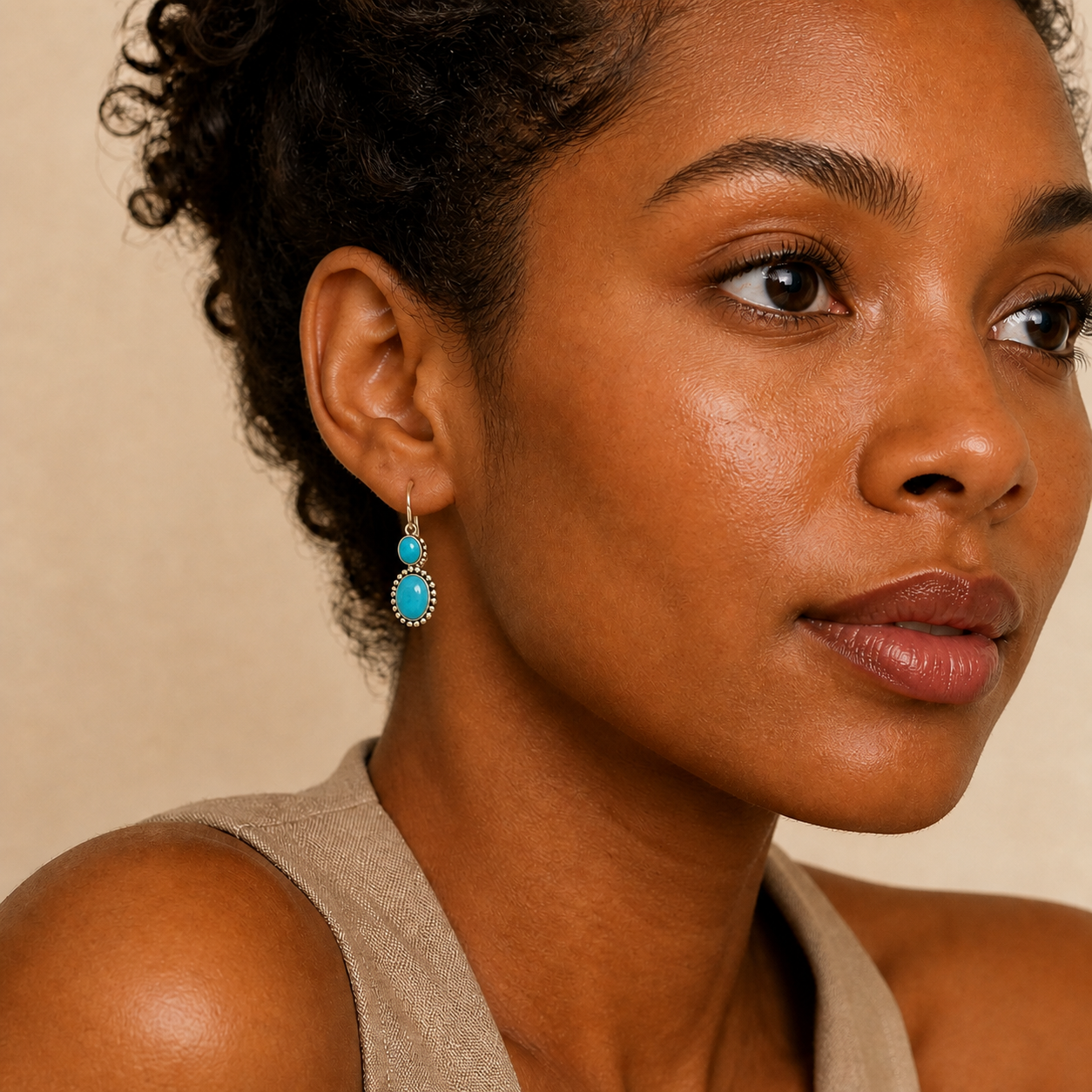 Young adult woman wearing PJ Luxe two-stone turquoise dangle sterling silver earrings