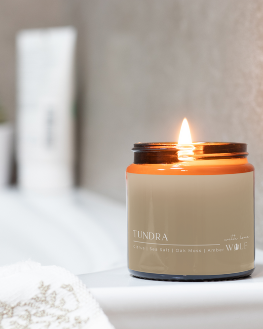 Wolf Candle Co Tundra 220 g candle styled in a calm bathroom setting